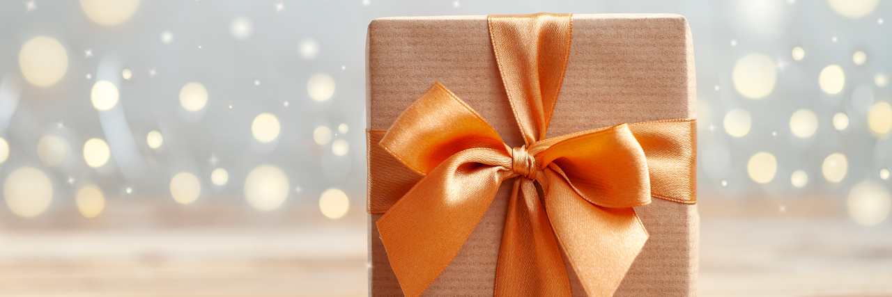 10 Best Gifts for a Friend With Endometriosis Gift box wrapped with craft paper and bow.