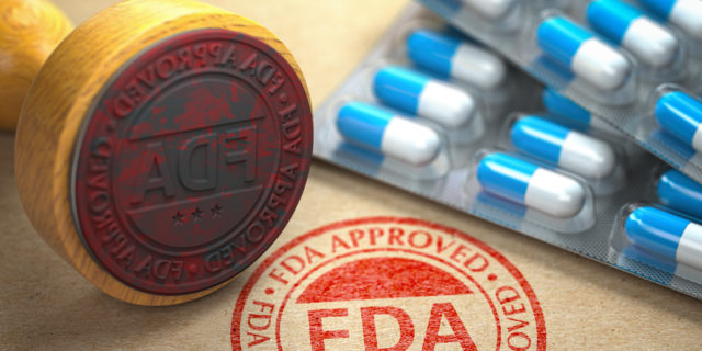 An FDA approved stamp near pills.