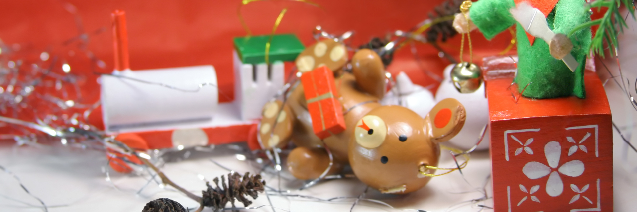 Tackling the Holidays With a Traumatic Brain Injury Ornaments scattered under Christmas tree.