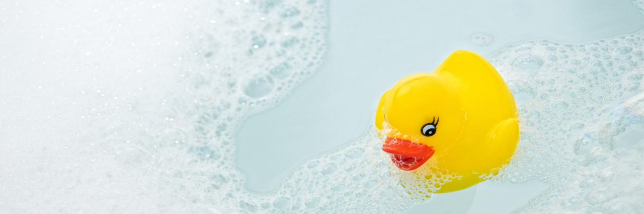 Rubber duck in bubble bath.