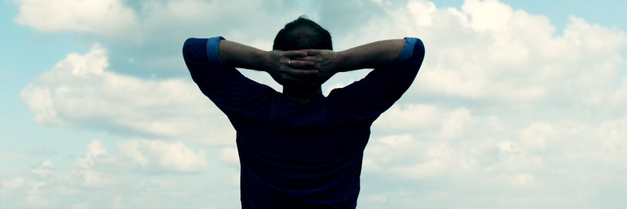 What It's Like Dealing With Ever-Changing Parkinson's Symptoms a man looking into the sky