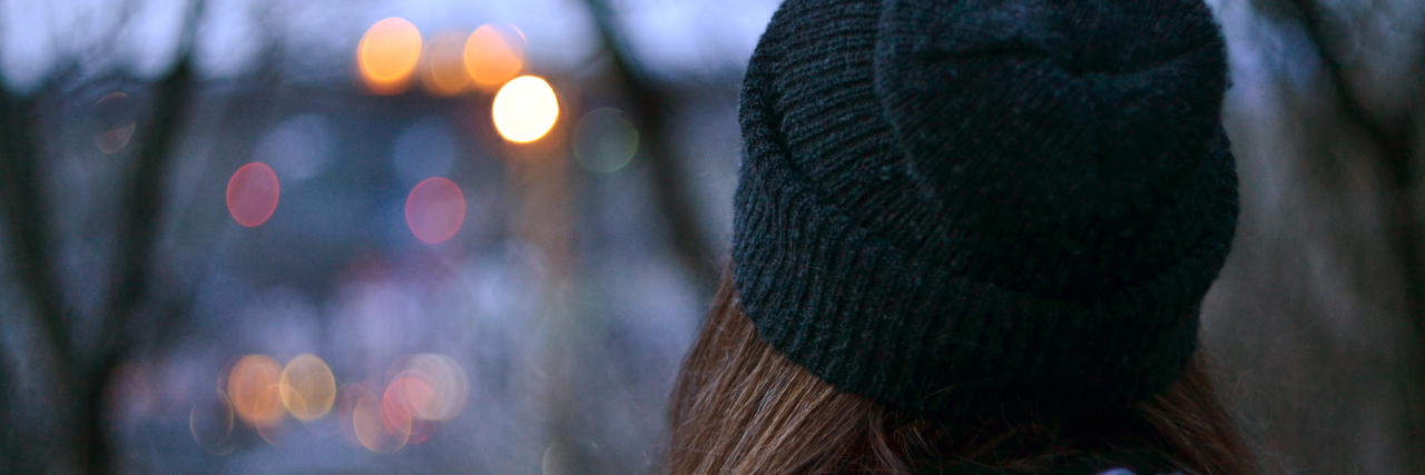 The Grief of the First Christmas Without My Dad a girl watching the city