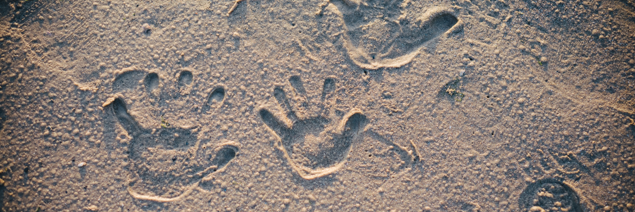 Balancing Therapies and Family Time for Kids on the Autism Spectrum Handprints in the sand.