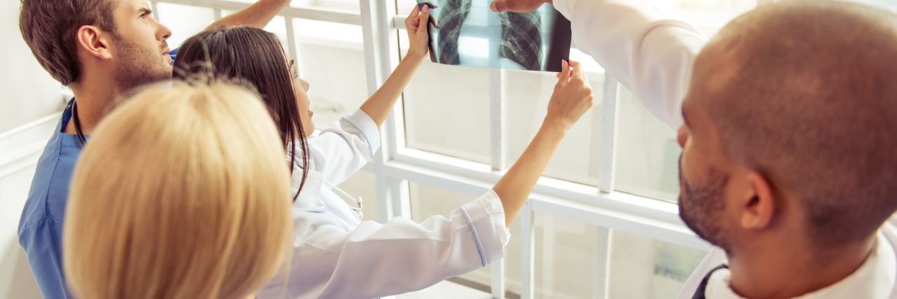 Finding an Undiagnosed Diseases Program in the US medical doctors looking at X-rays together