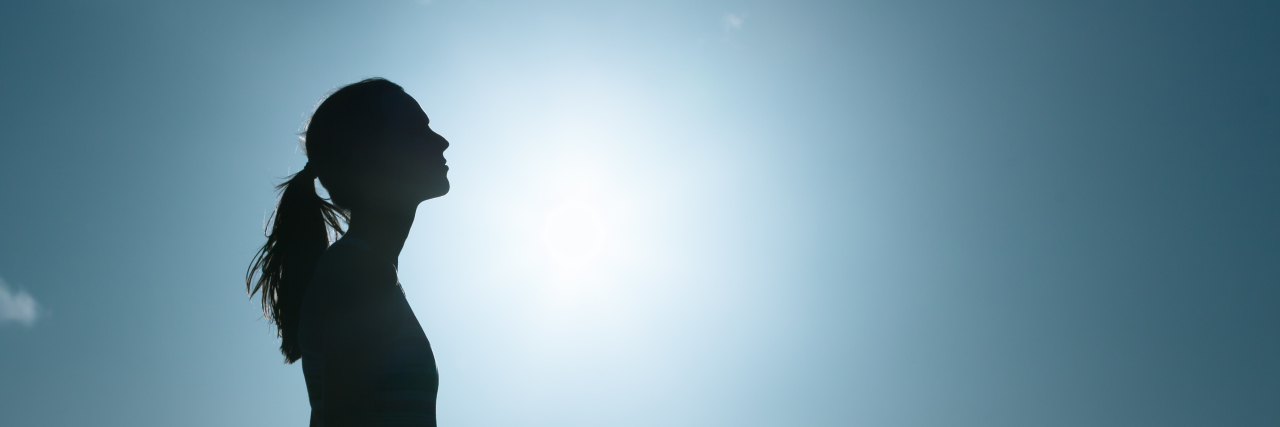 Tips for Managing Anxiety When You Have a Medically Complex Child Young woman looking up into the sky.