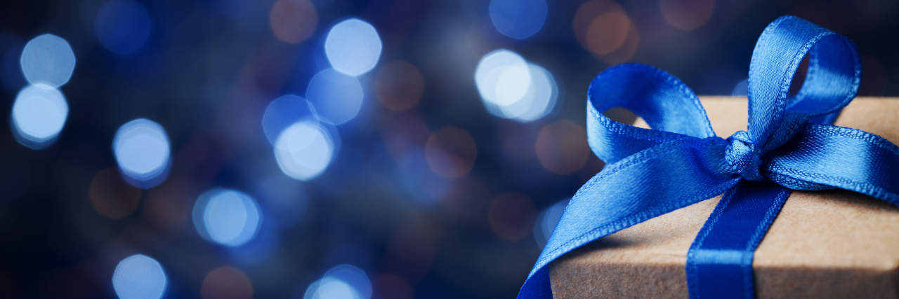 18 Gifts Your Friend With Arthritis Will Love Gift box with blue bow.