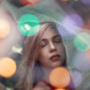 Woman dazed with lights overlaying image.