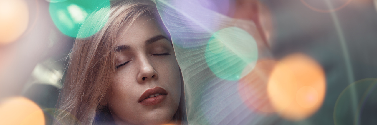 Epilepsy Doesn't Always Look Like the Stereotypes Woman dazed with lights overlaying image.