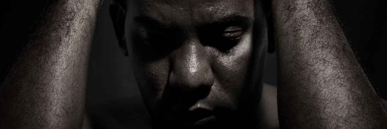 How I Navigate Negative Morning Thoughts With Bipolar Disorder Man with hands on head