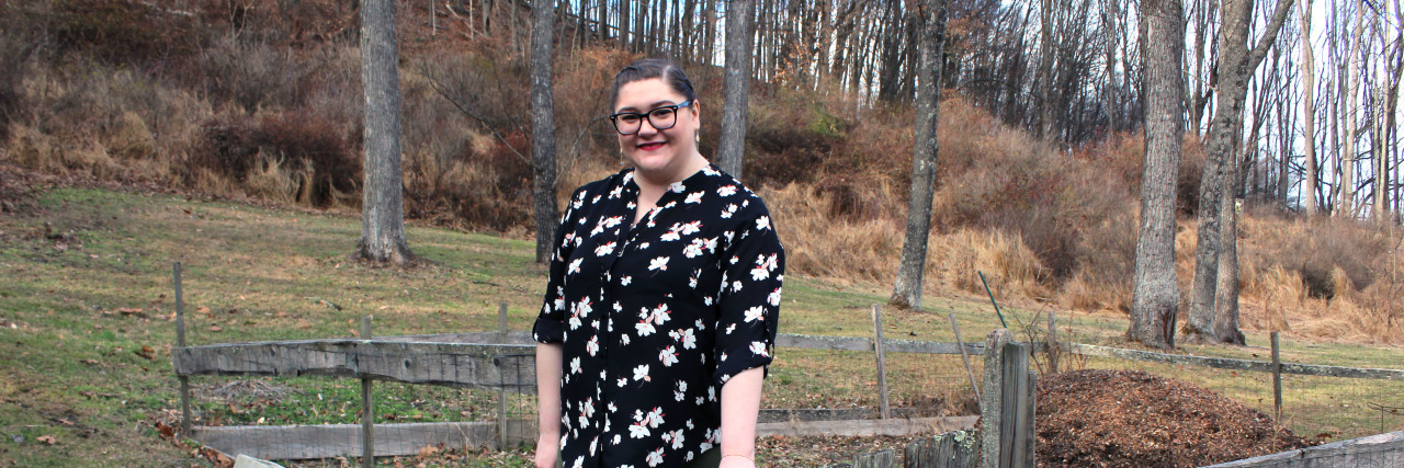 Chronic Illness Doesn't Mean I'm 'Broken' Grace standing by a gate.