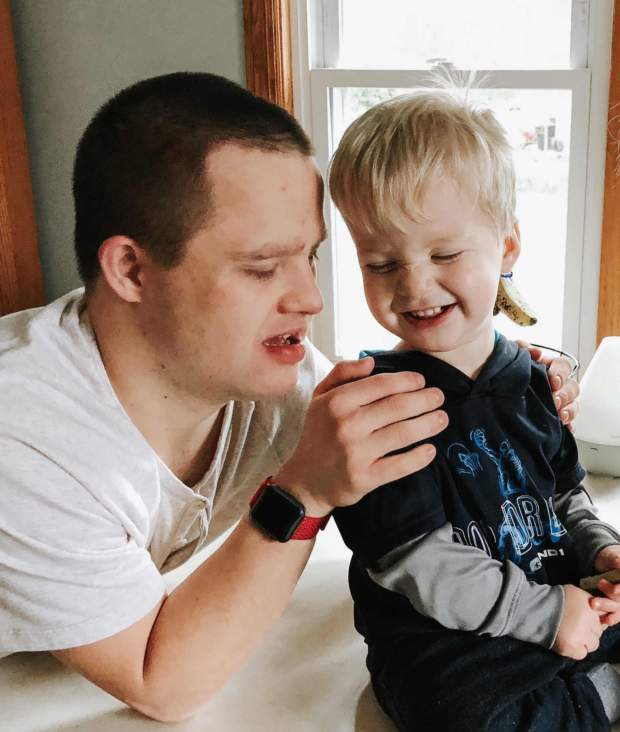 Erin's brother who has Down syndrome and her son.