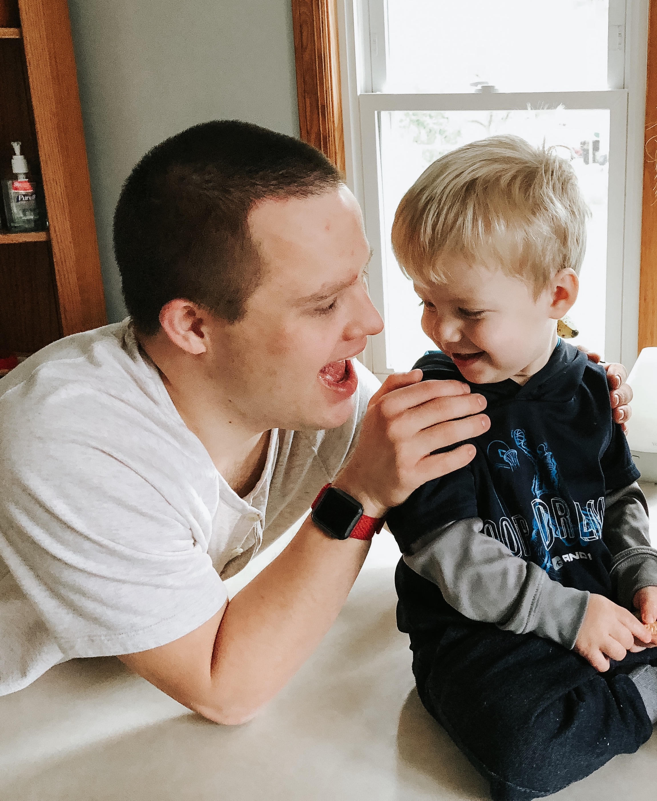 Erin's brother who has Down syndrome and her son.