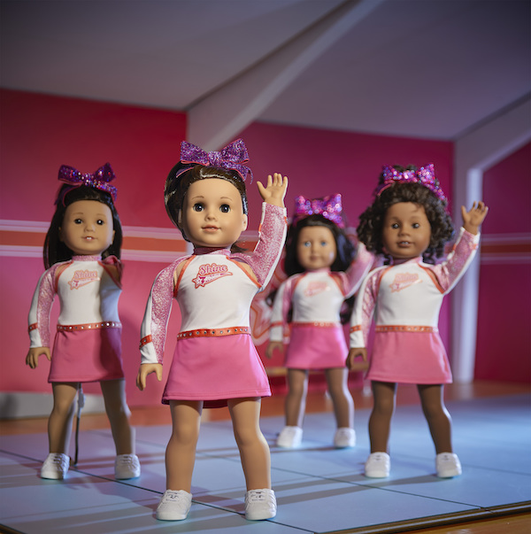 American Girl doll Joss Kendrick at the front of a cheerleading squad