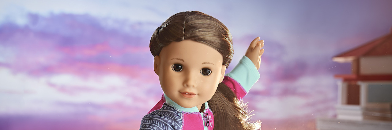 American Girl Names First Hard-of-Hearing Doll 2020 Girl of the Year American Girl doll Joss Kendrick on a surfboard