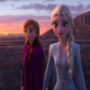 screen shot from Frozen II trailer of Anna and Elsa standing together, looking gravely in the distance