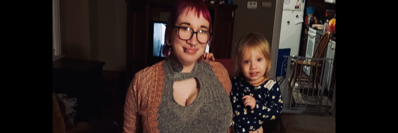 What It's Like Giving Up Your Kids After a Traumatic Brain Injury a pregnant mom is standing with her three daughters