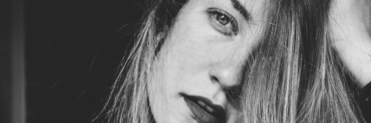 How to Cope When Anxiety Makes You Feel Out of Control black and white photo of woman looking into camera with light hair