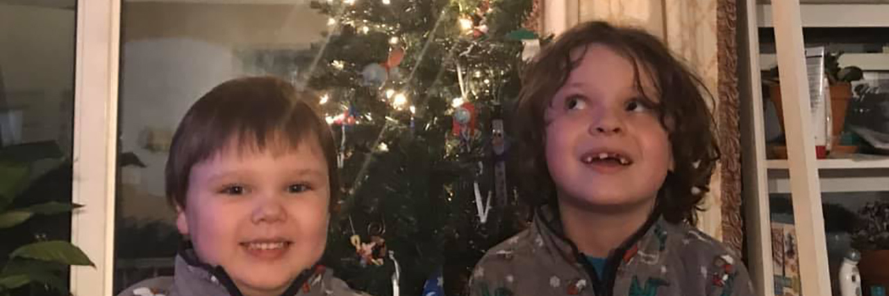 Jeremy's sons in front of the Christmas tree.