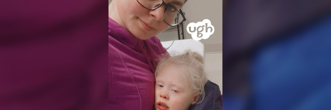When Kids With Disabilities Get Sick During the Holidays Robert is resting his head on his mama's chest as she takes a selfie photo. He looks sick and tired, and she looks tired and worried.
