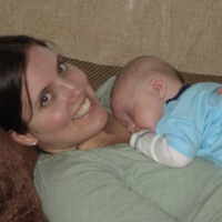 photo of contributor vanna winters lying back and holding baby on her chest, smiling into camera