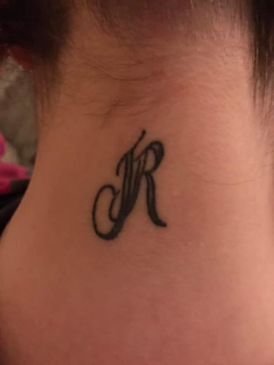 Valierie shows off a tattoo of two letters, which is located on her neck.