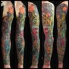 An arm with sleeve-length tattoos is photographed from multiple angles. It features a lion with a crown, a crow wearing a jester's cap, a scepter, and some flowers and gems.