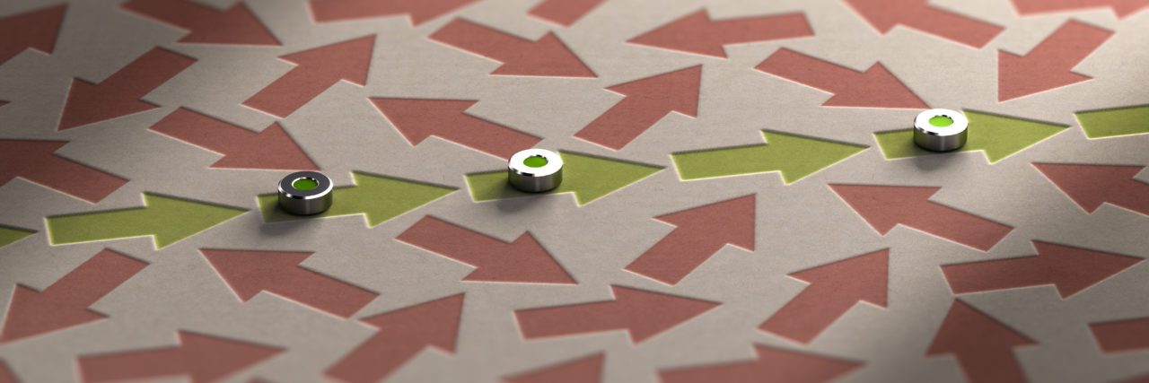 Being 'Particular' as Someone on the Autism Spectrum Arrows going straight ahead through a mess of chaotic arrows pointing in many directions.