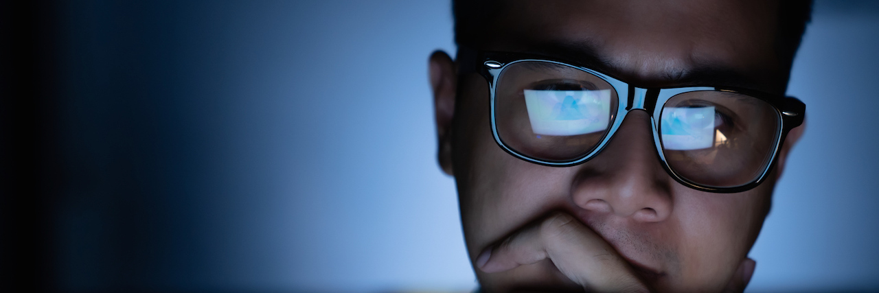 Don't Make My Suicide Attempt Story About You A focused and serious looking man with glasses