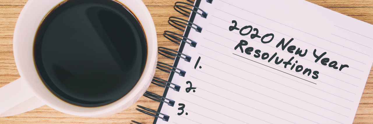 Making Realistic New Year Resolutions With a Rare Disease image of notebook and pen with a cup of coffee "2020 new years resolutions" written on pad