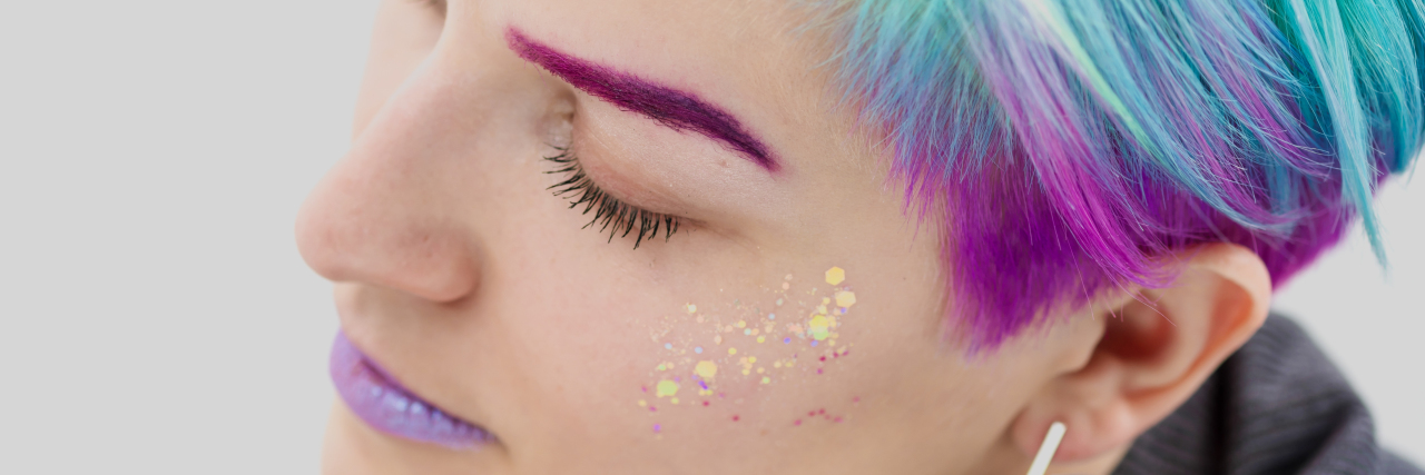 Ways People Cope With Having a Chronic Illness Thoughtful woman with short, colorfully-dyed hair.