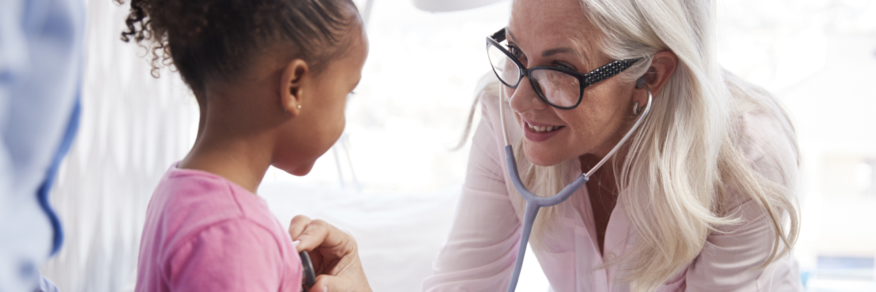 Thanking the Medical Professionals Who Help Our Children Female doctor examining young girl.