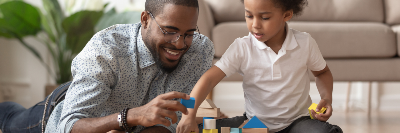 3 Facts No One Tells You About Special Education Law Father playing blocks with his son.