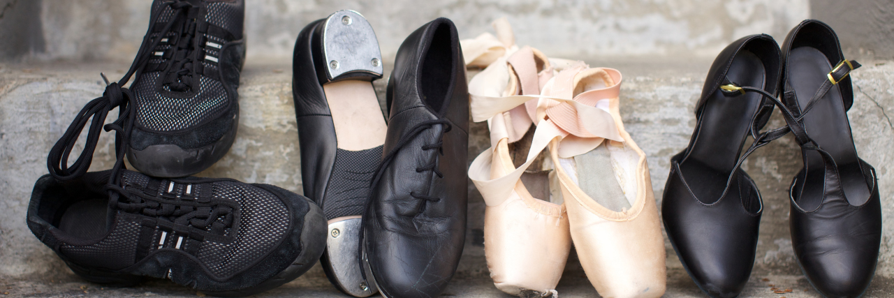 Letter to Cerebral Palsy: We Are a Partnership Closeup of a pair of jazz shoes, tap shoes, ballet pointe shoes, and character shoes.
