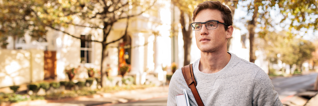 Navigating College in Recovery from an Eating Disorder Young male student walking outside