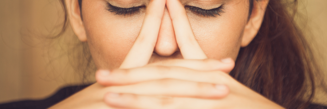 Myalgic Encephalomyelitis and Post-Exertional Malaise: How to Cope close-up of the face of a woman, looking tired and frustrated