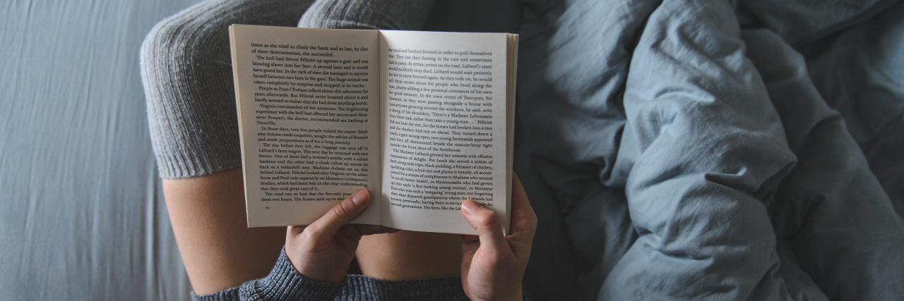 How Distraction Can Help Relieve Chronic Pain Woman reading book in bed.
