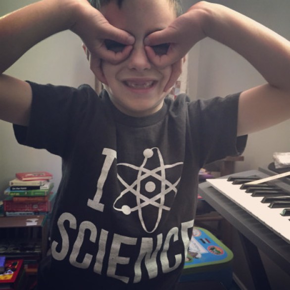 Caitlin's son wearing an I love science t-shirt.