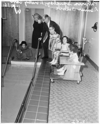 Children on a slide at Harlan Shoemaker school.