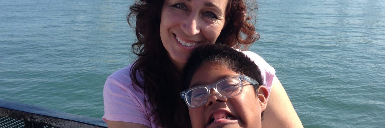 Fighting for Inclusion for My Child With Down Syndrome Michelle hugging her son.