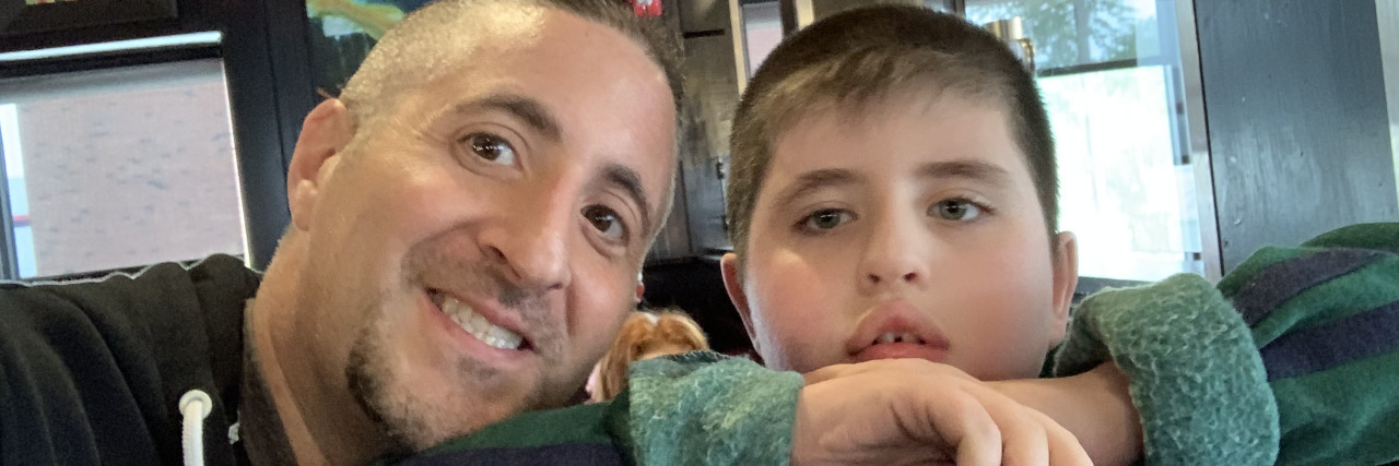 I'm Not a Hero for Being a Good Dad to My Son With Autism James smiling with his son.