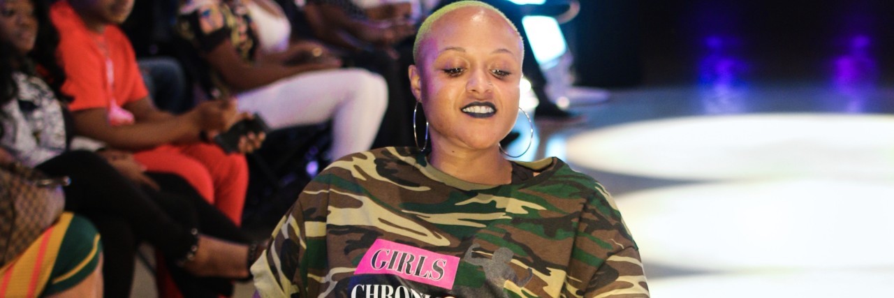 Beyonce Songs That Have Helped Me Through Muscular Dystrophy A woman in a wheelchair on a fashion runway.