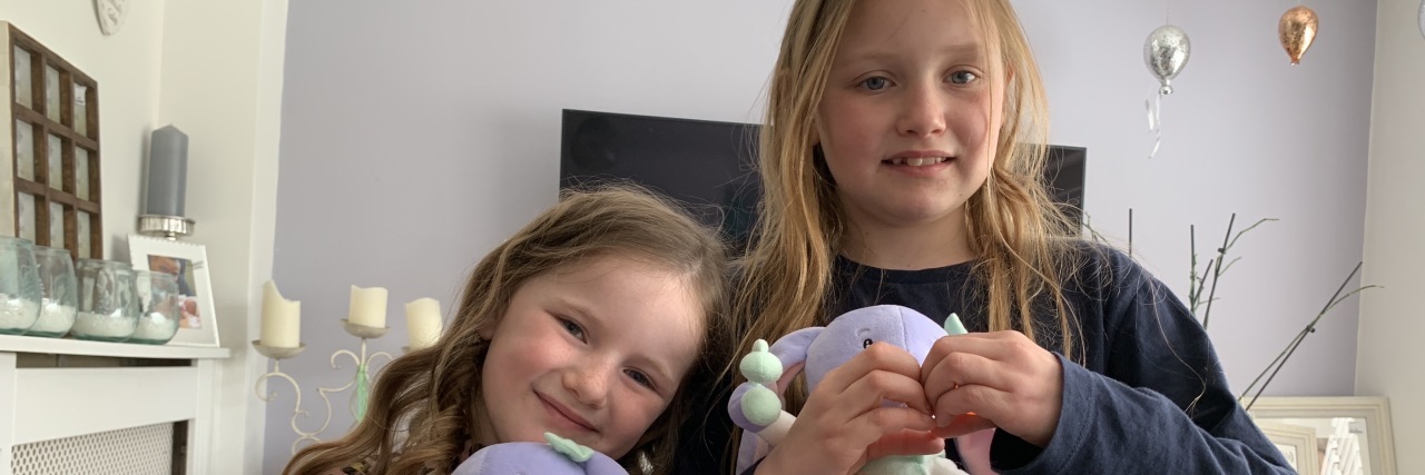 How 'Autism With Lola' Books Are Teaching Kids About Disabilities Beautiful plush rabbit toy helping children relate.