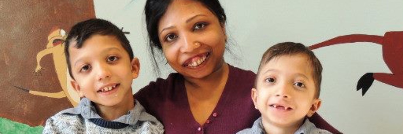 5 Things to Know About Jansen’s Metaphyseal Chondrodysplasia A photo of Neena and her two young sons.