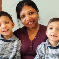 A photo of Neena and her two young sons.