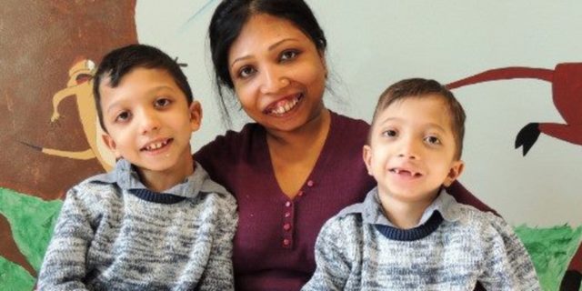 A photo of Neena and her two young sons.