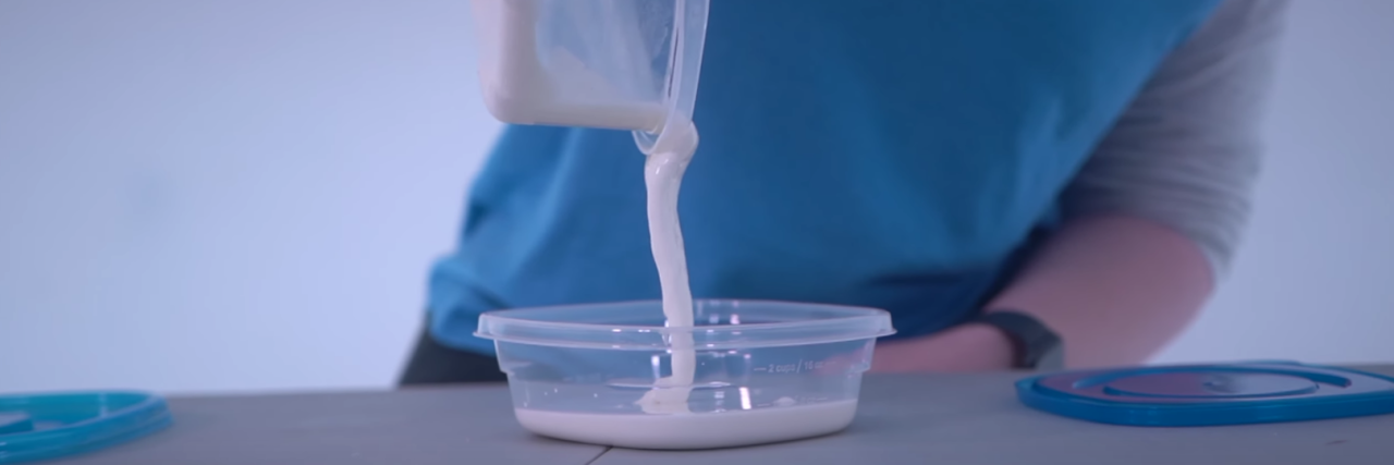 The author pouring "white goo" into a container