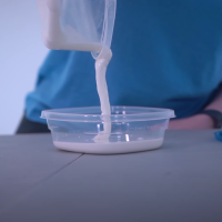 The author pouring "white goo" into a container