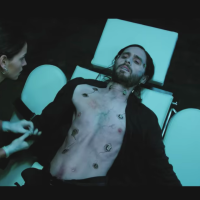 From the trailer "Morbius," Michael Morbius, played by Jared Leto, lays on a hospital bed with marks on his chest. He looks frail and sick.