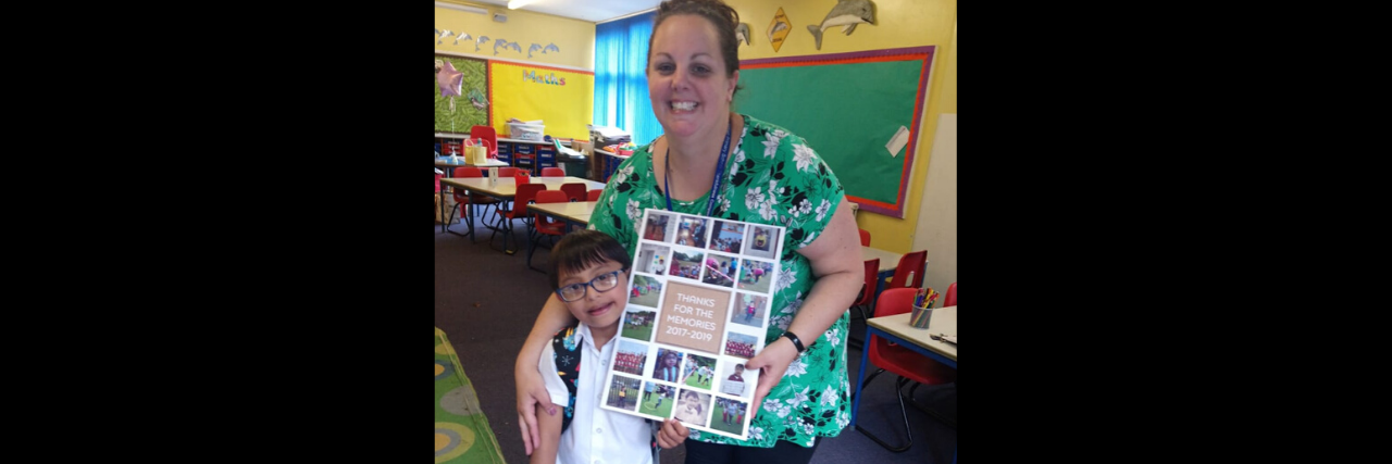 The Letter I Received From My Son With Down Syndrome's First Teacher a teacher standing in a classroom with her young student