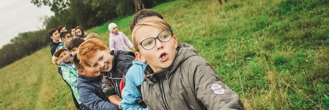 Why Inclusion Helps All Children Kids play tug of war.